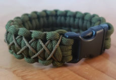 Cobra cross-stitch with buckle closure